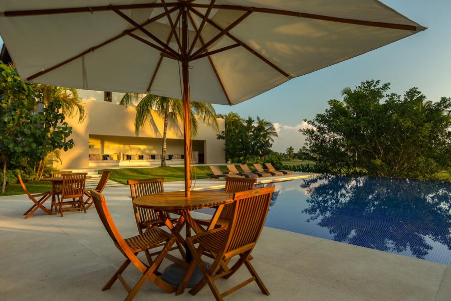 Poolside dining terrace overlooking the fairway