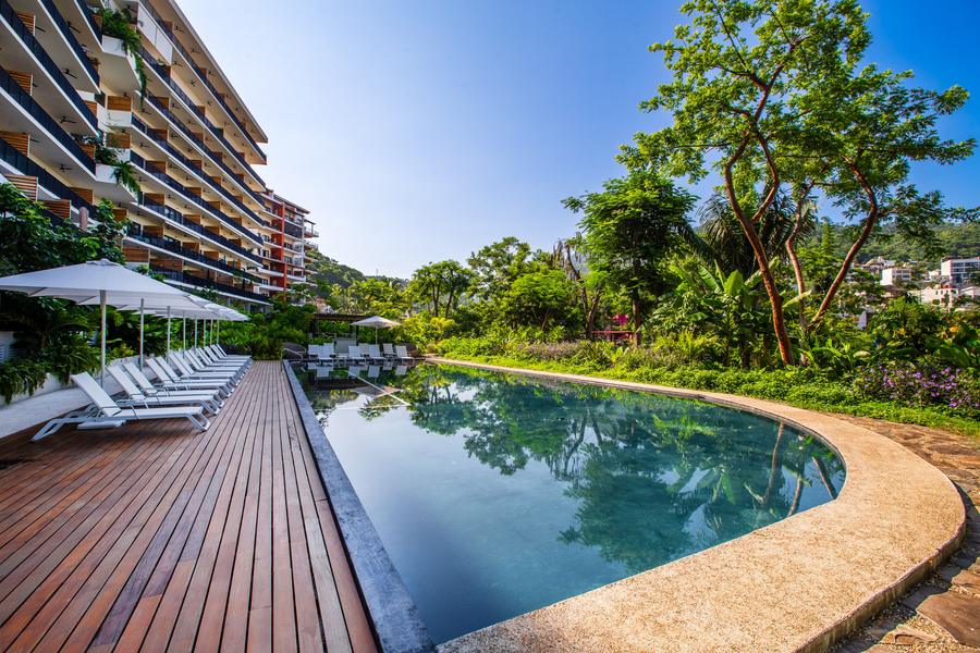 Teak pool deck and infinity edge at Oasis