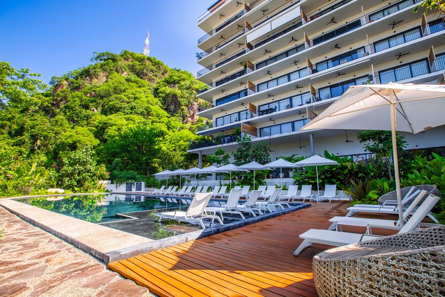 Pool terrace and shaded loungers