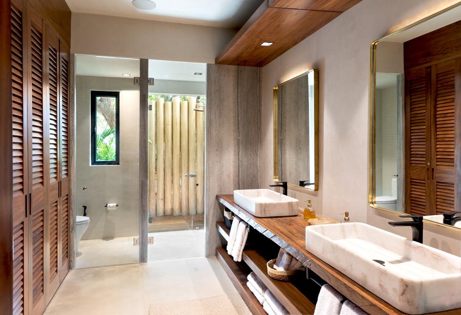 Spa-style bath with stone tub and garden view