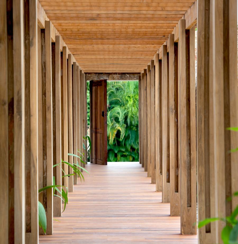 Timber colonnade walkway to the residence