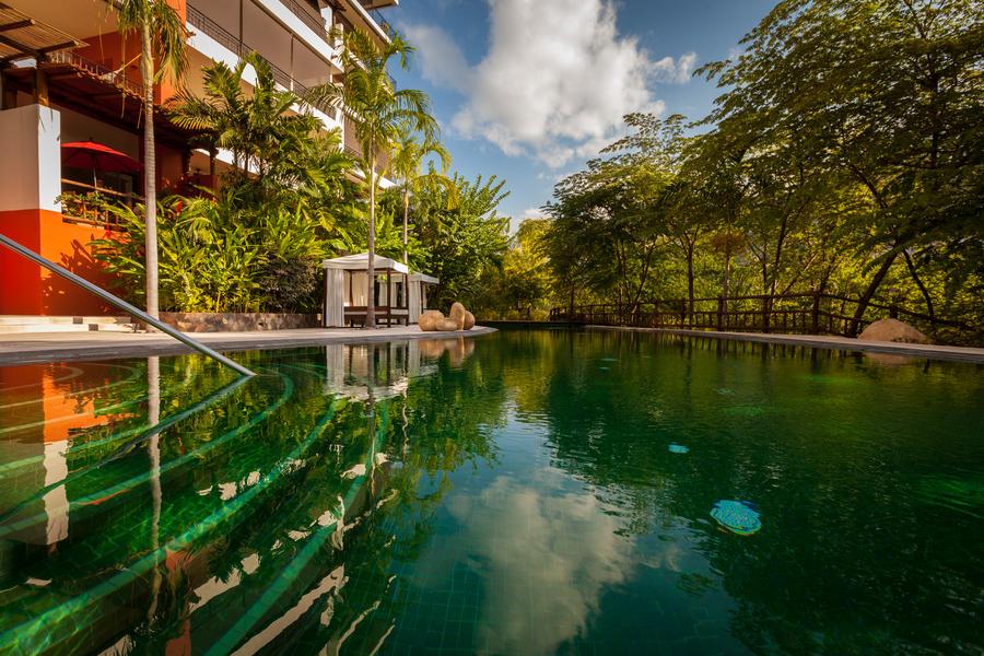 Pool terrace reflecting the residences
