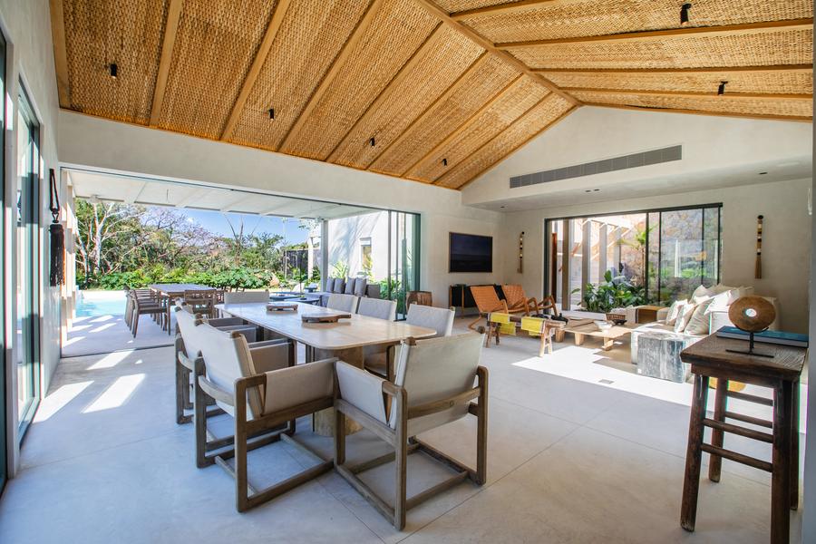 Open living and dining space facing the pool