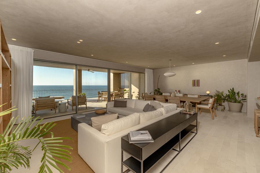 Open living and dining area facing the sea