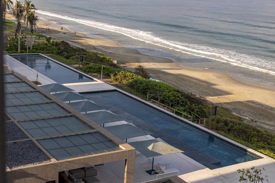 Pool deck and beachfront at UAVI