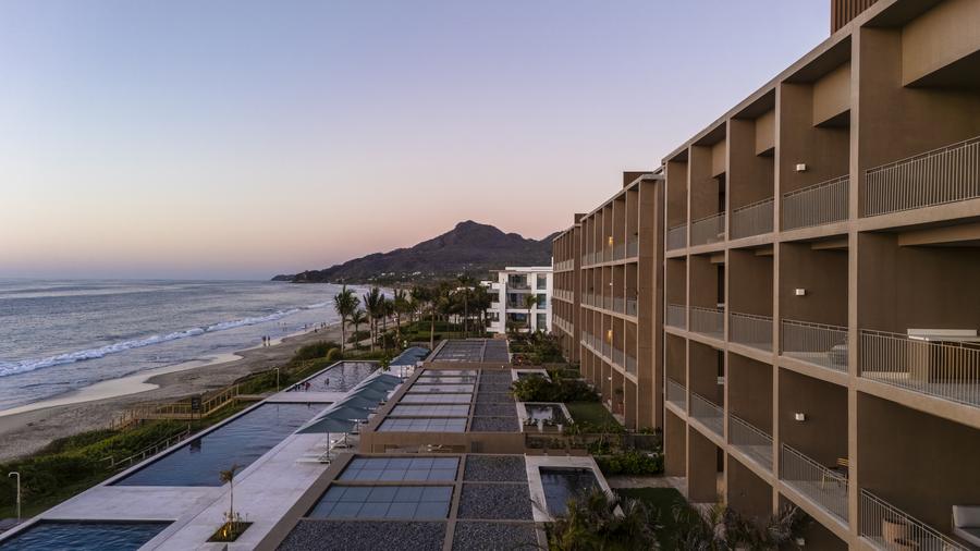 Aerial view of the pool, beach and mountains